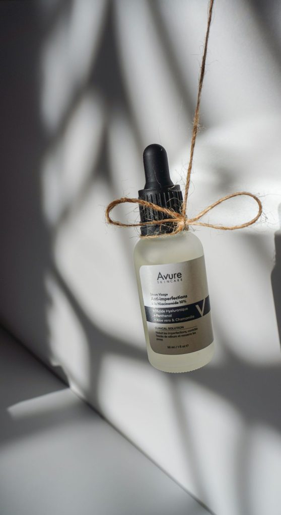 Glass serum bottle with dropper in natural light