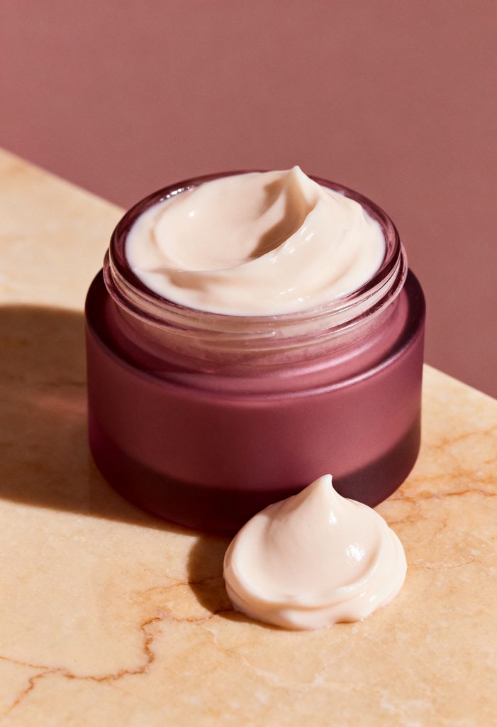 First Aid Beauty Ultra Repair Cream jar with soft skincare styling